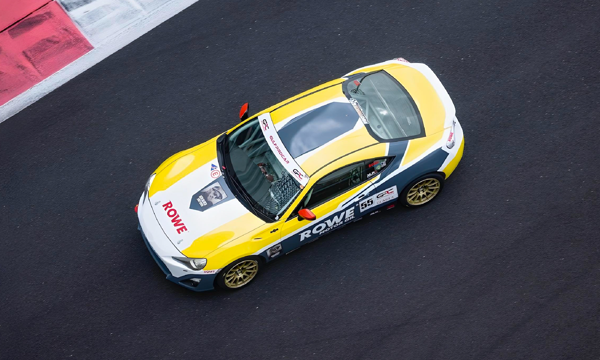 Technician inspecting underbody on lift